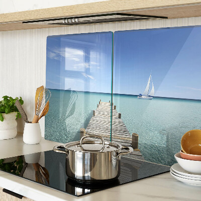Glass kitchen board Pier over the turquoise sea