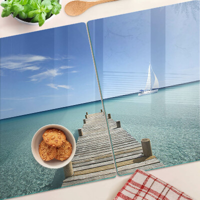 Glass kitchen board Pier over the turquoise sea