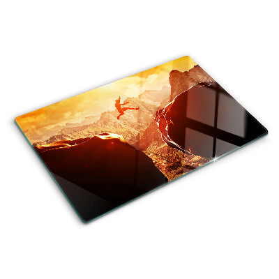 Glass chopping board Jumping in the mountains at sunset