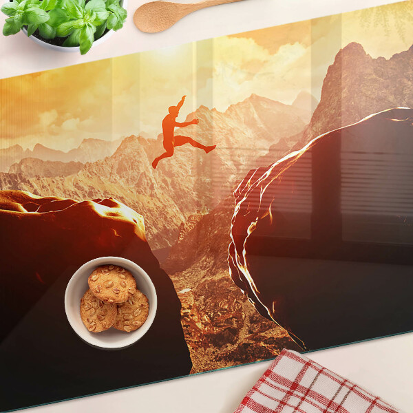 Glass chopping board Jumping in the mountains at sunset