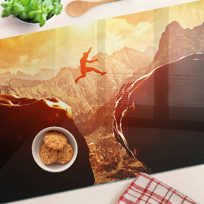 Glass chopping board Jumping in the mountains at sunset