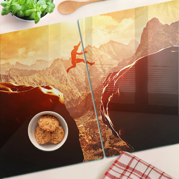 Glass chopping board Jumping in the mountains at sunset