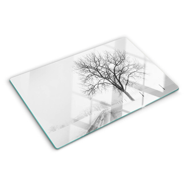 Glass kitchen board Empty winter landscape with a tree