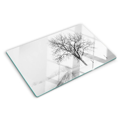Glass kitchen board Empty winter landscape with a tree