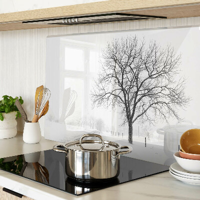 Glass kitchen board Empty winter landscape with a tree