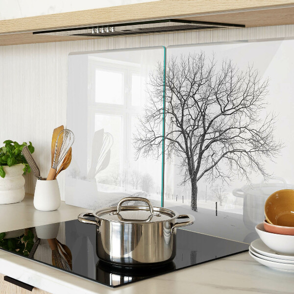 Glass kitchen board Empty winter landscape with a tree