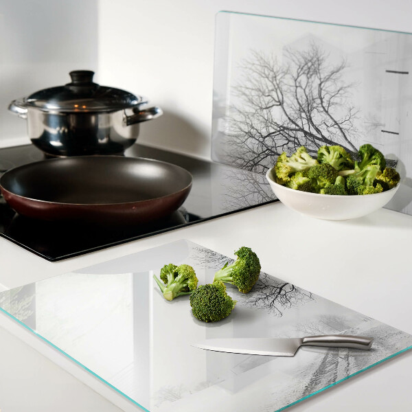 Glass kitchen board Empty winter landscape with a tree