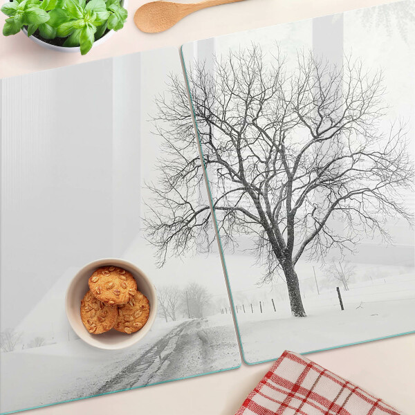 Glass kitchen board Empty winter landscape with a tree