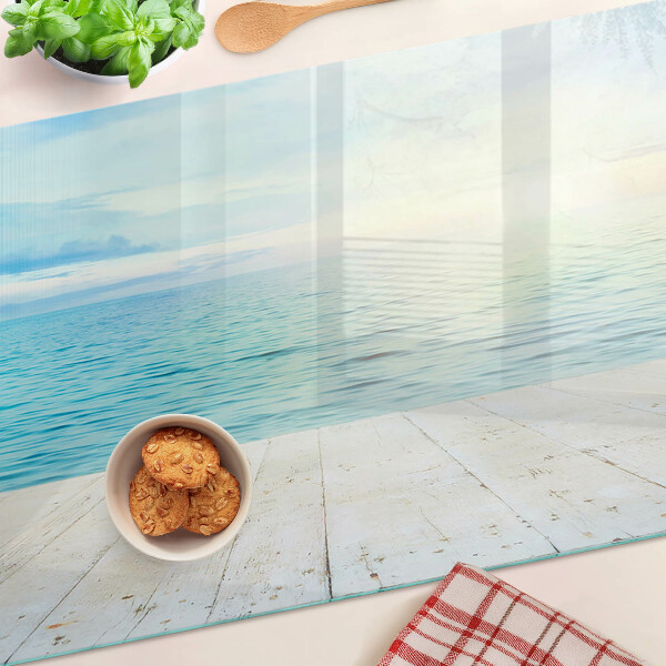 Glass cutting board The sea and the wooden jetty