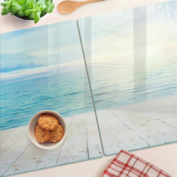 Glass cutting board The sea and the wooden jetty
