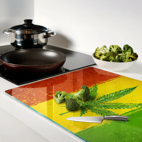 Glass cutting board Cannabis leaf on a colorful background