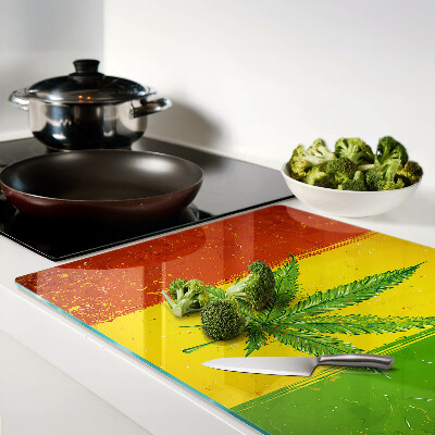 Glass cutting board Cannabis leaf on a colorful background