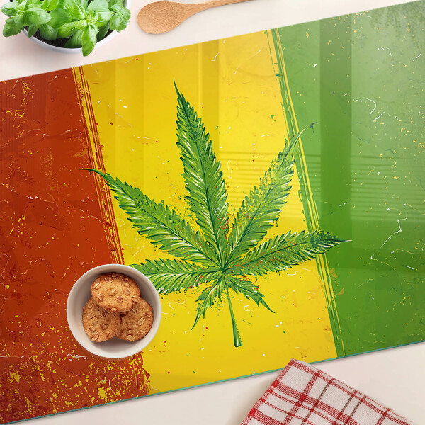 Glass cutting board Cannabis leaf on a colorful background