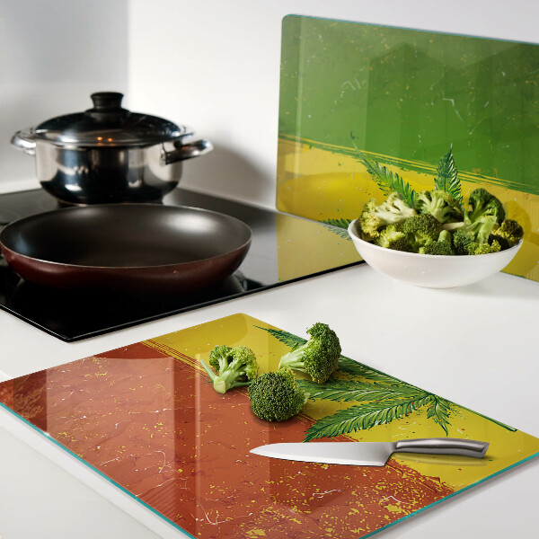 Glass cutting board Cannabis leaf on a colorful background
