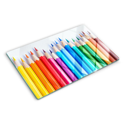 Chopping board Colored pencils in a row