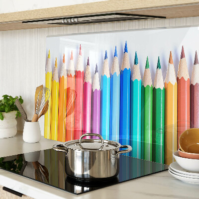 Chopping board Colored pencils in a row