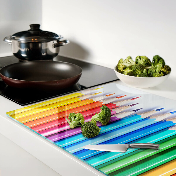 Chopping board Colored pencils in a row