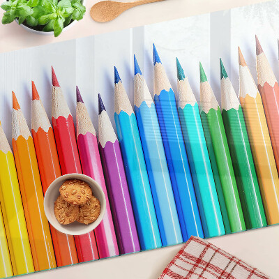 Chopping board Colored pencils in a row