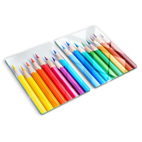 Chopping board Colored pencils in a row