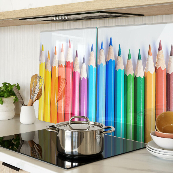 Chopping board Colored pencils in a row