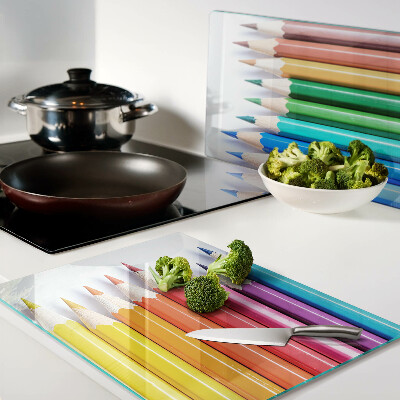 Chopping board Colored pencils in a row