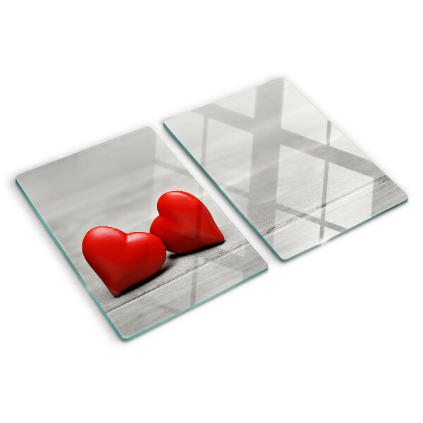 Cutting board Red hearts on a wooden background