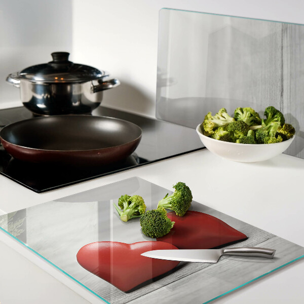 Cutting board Red hearts on a wooden background