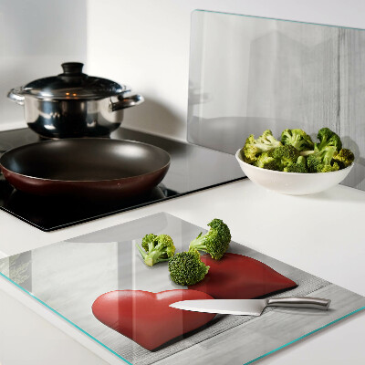 Cutting board Red hearts on a wooden background