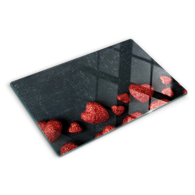 Glass chopping board Red hearts on a dark background