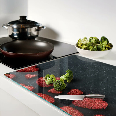 Glass chopping board Red hearts on a dark background