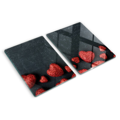 Glass chopping board Red hearts on a dark background