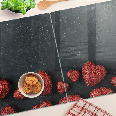 Glass chopping board Red hearts on a dark background