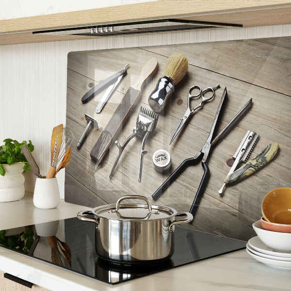 Glass cutting board Hairdressing tools on a wooden background