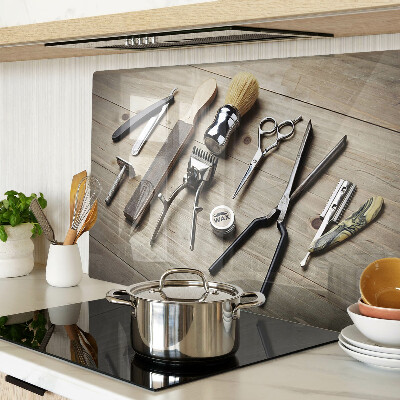 Glass cutting board Hairdressing tools on a wooden background
