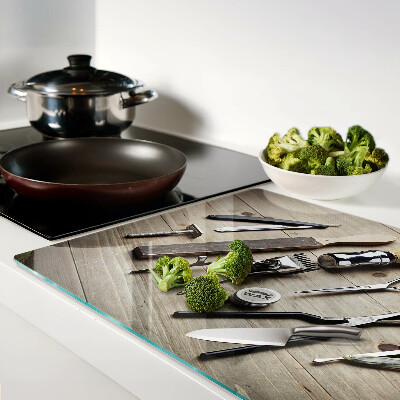 Glass cutting board Hairdressing tools on a wooden background