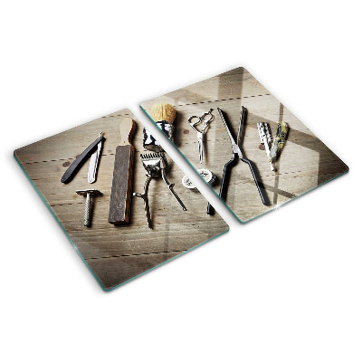 Glass cutting board Hairdressing tools on a wooden background