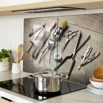 Glass cutting board Hairdressing tools on a wooden background