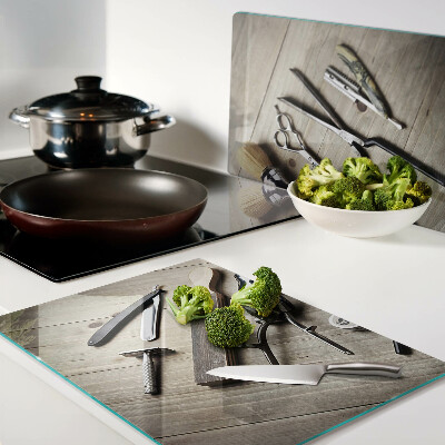 Glass cutting board Hairdressing tools on a wooden background