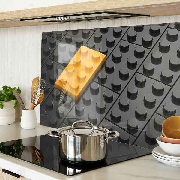 Chopping board glass LEGO bricks on a black background