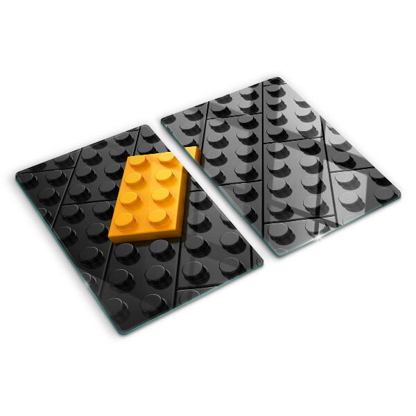 Chopping board glass LEGO bricks on a black background