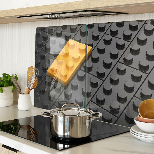 Chopping board glass LEGO bricks on a black background