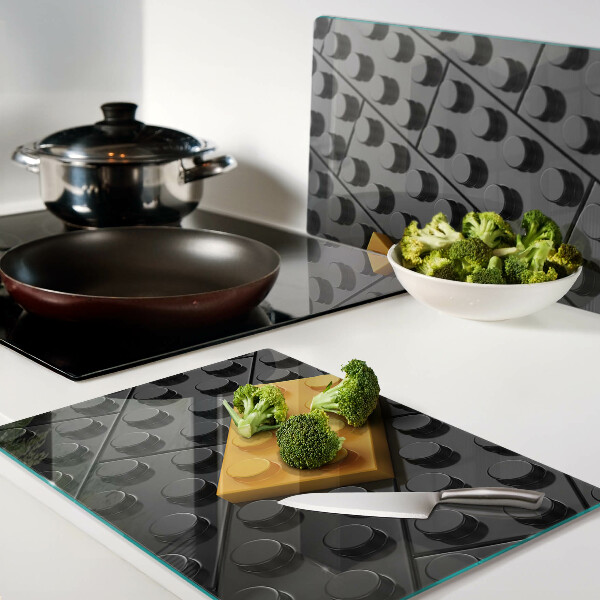 Chopping board glass LEGO bricks on a black background