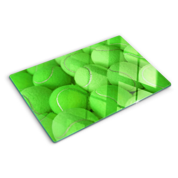 Cutting board Tennis balls on a green background