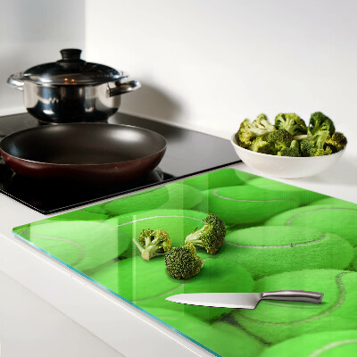 Cutting board Tennis balls on a green background