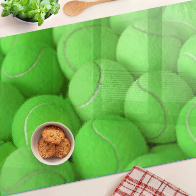 Cutting board Tennis balls on a green background