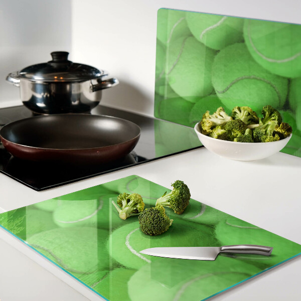 Cutting board Tennis balls on a green background