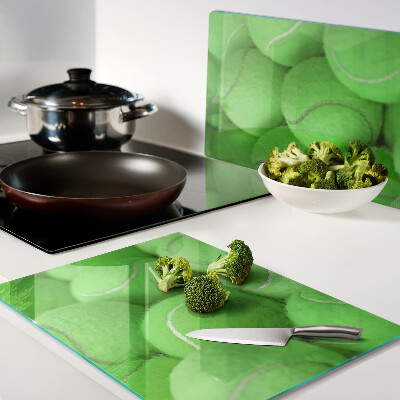 Cutting board Tennis balls on a green background