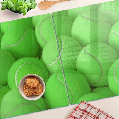 Cutting board Tennis balls on a green background