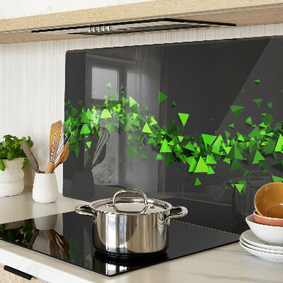 Glass kitchen board Green triangles on a black background