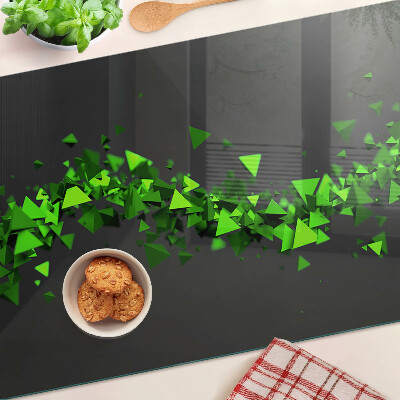 Glass kitchen board Green triangles on a black background